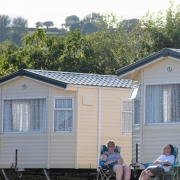 Guests sat outside holiday home